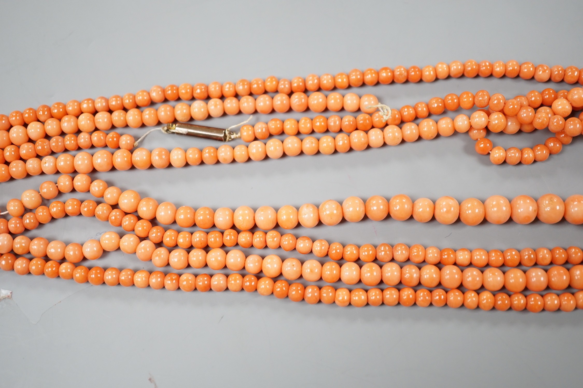 Two single strand coral bead necklaces, one a.f., longest 103cm.
